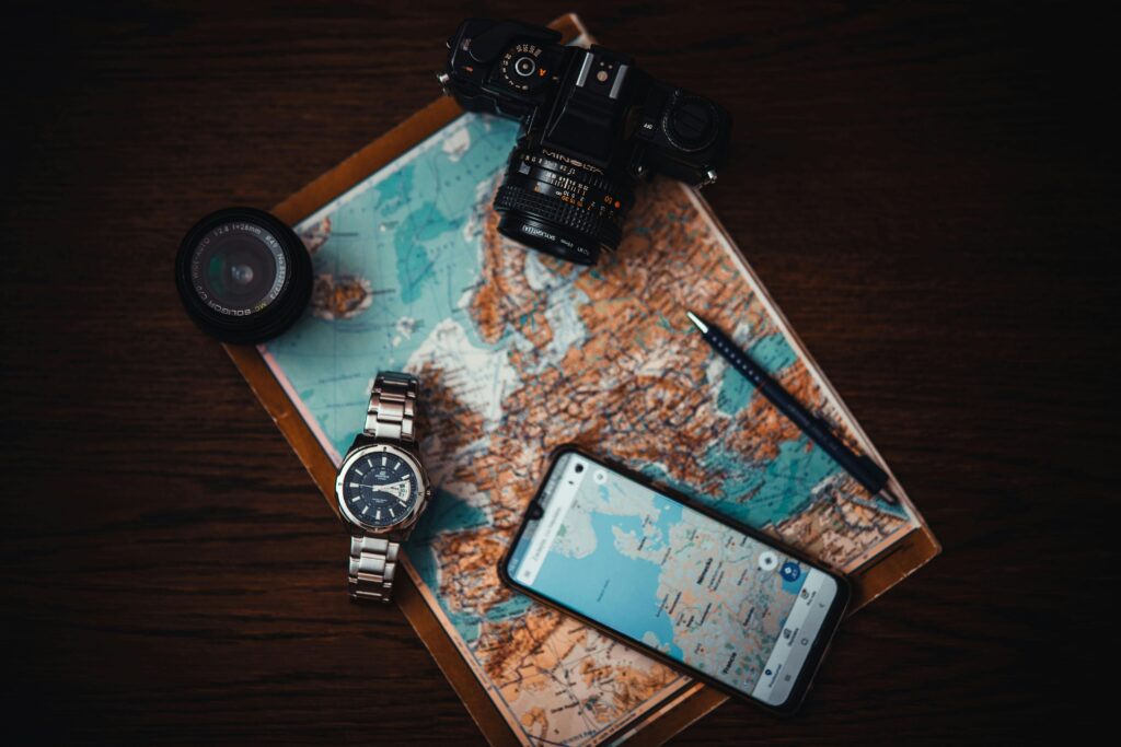 how to plan a trip - travel - map - phone - camera